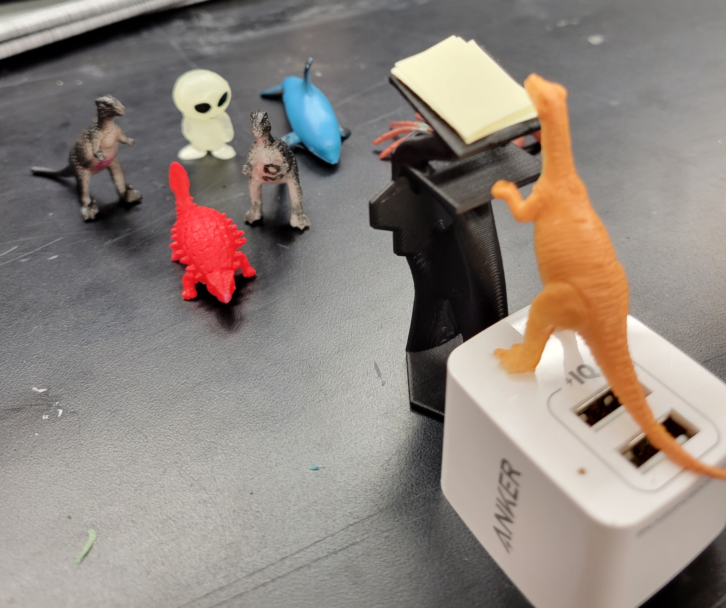 A scaled down model of the podium printed without supports (dinosaurs for scale)